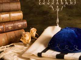 Kippa, torah chumash books, tallis, and Hannukia menorah