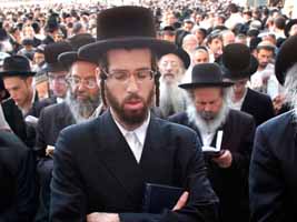 A crowd of orthodox jewish men