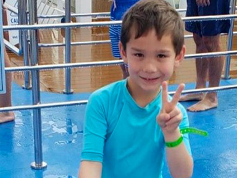 Five year old boy missing after being swept away from mother s arms in