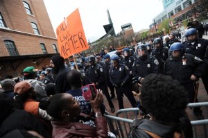 Protestors rally at Oriole Park at Camden Yards during a march for Freddie Gray, Saturday, April 25, 2015. Gray died from spinal injuries about a week after he was arrested and transported in a police van .(AP Photo/Gail Burton) (Gail Burton - AP)