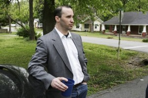 Everett Dutschke waits for federal authorities to search his home in Tupelo