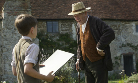 Roger (Milo Parker) and Sherlock Holmes (Ian McKellen) outside Sherlock's farm house. (Miramax)