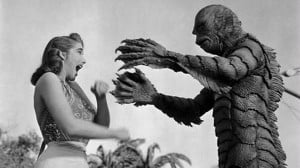 We're told that it's all harmless fun, but much of what mass media pipes into our minds affects the way we think. So who's making this stuff? Image clip from 1954 movie Creature from the Black Lagoon