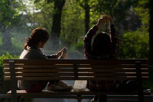 bench-people-smartphone-sun