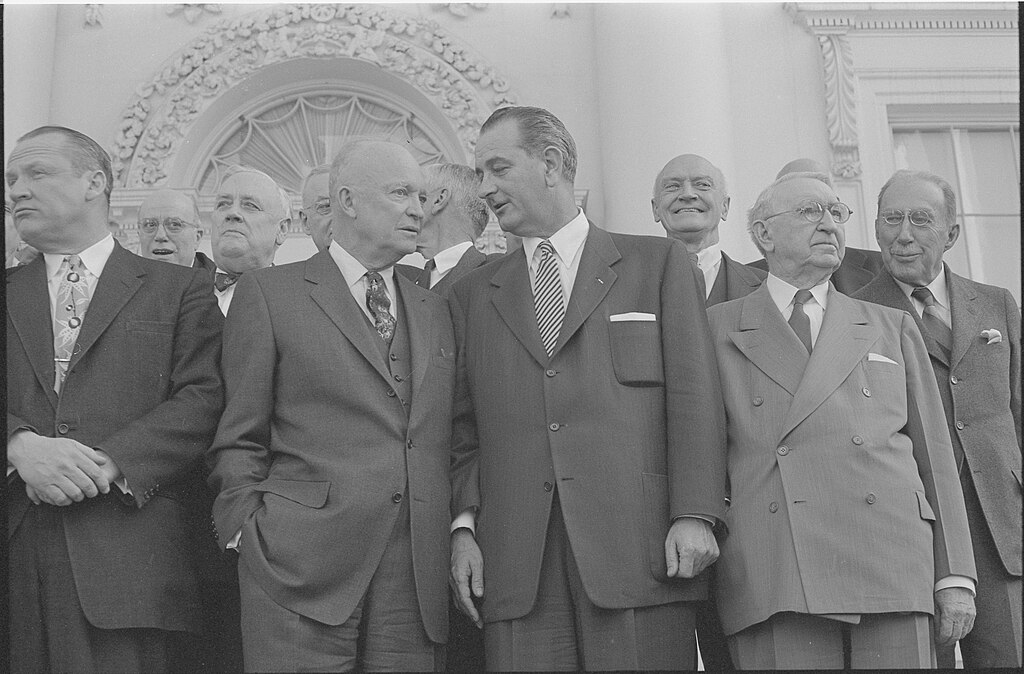 A black and white photo of elected officials including President Dwight Eisenhower and Senator Lyndon Johnson