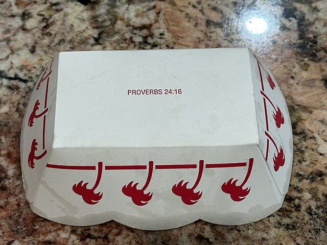 In-N-Out fries container with Proverbs 24:16 printed on bottom