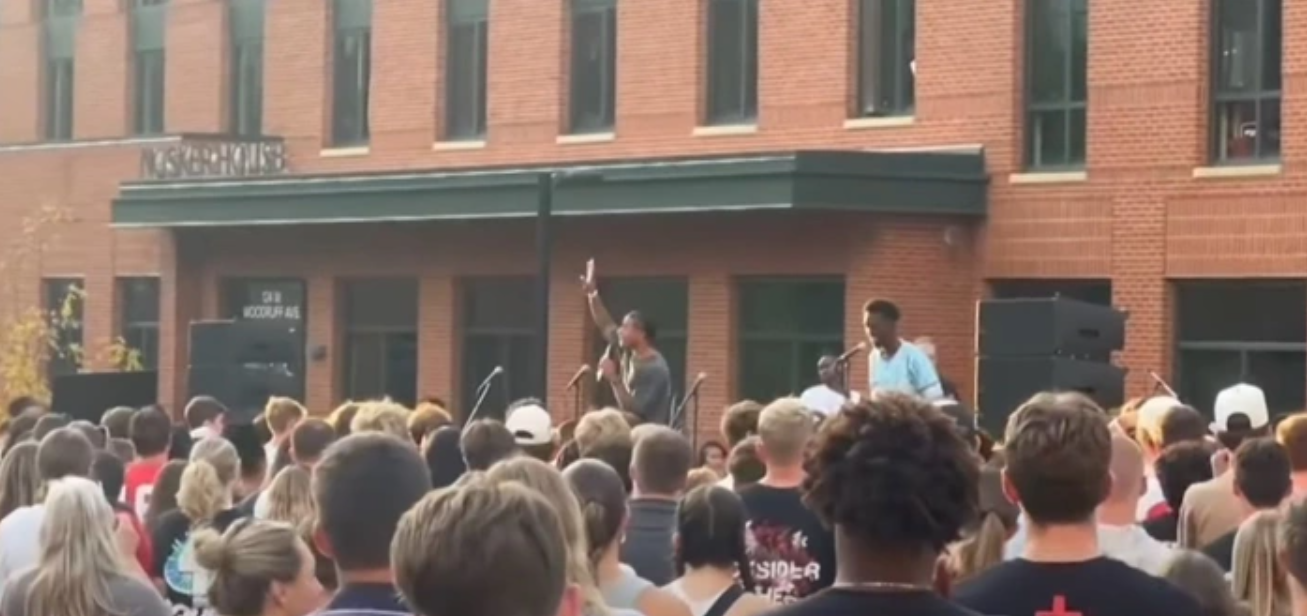 Ohio State University football players lead a campus revival service