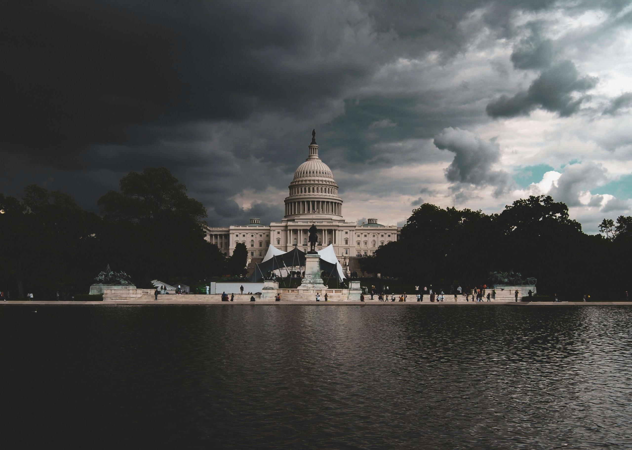 Dark looming clouds over the Mall at Washington and the U.S. Capitol.