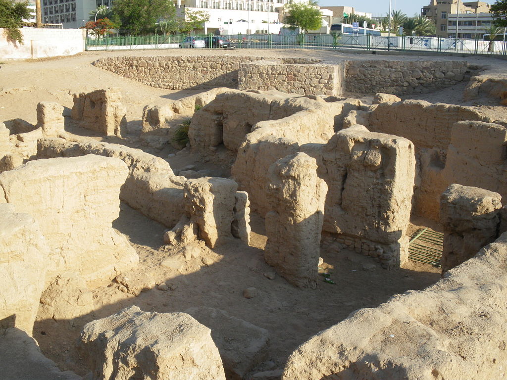 Stones from ancient ruins in Aqaba, Jordan surrounded by the modern city