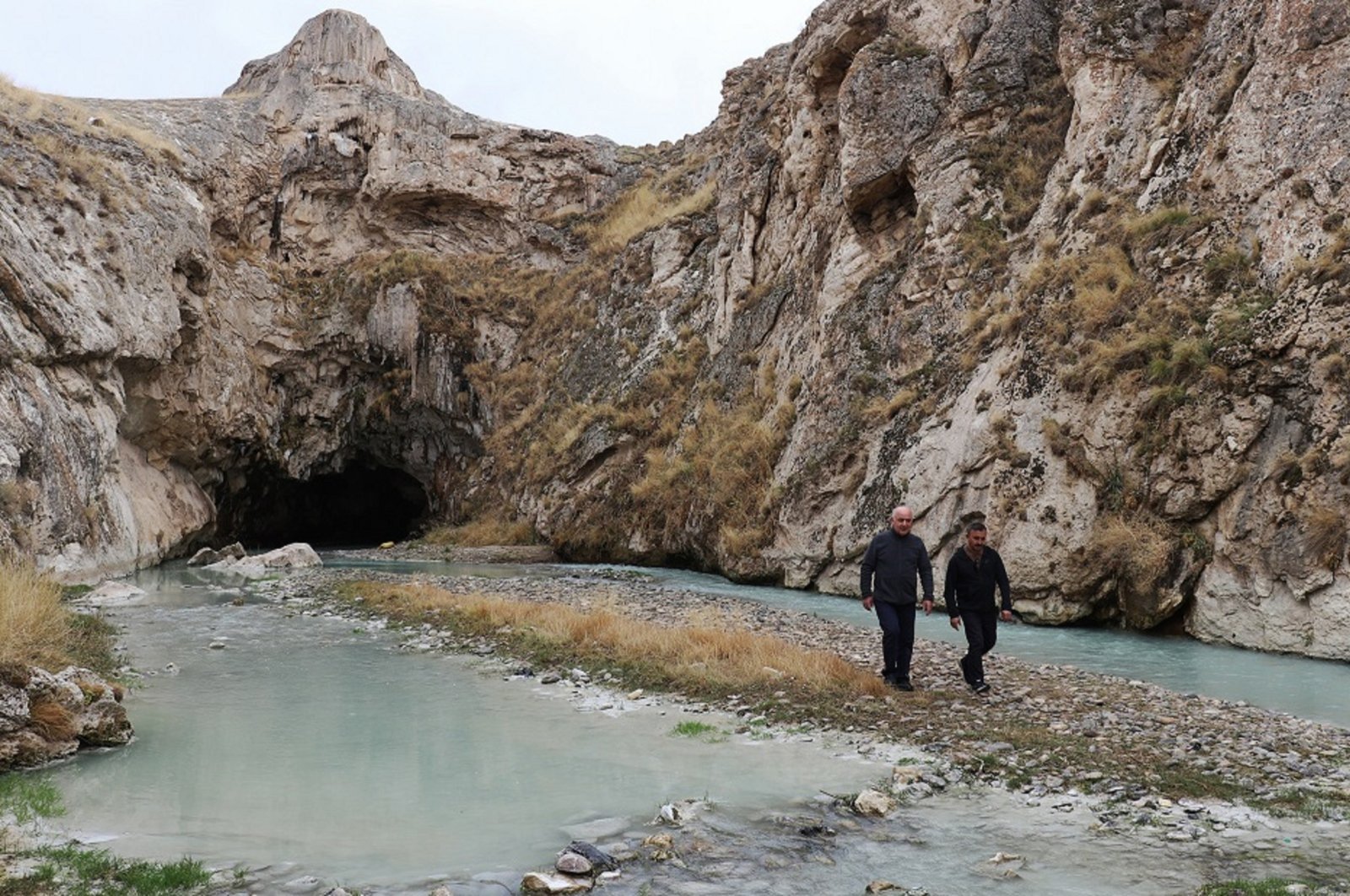 Two archaeologists walk an area in Agri, Turkiye where Noah's Ark is supposed to be located. 