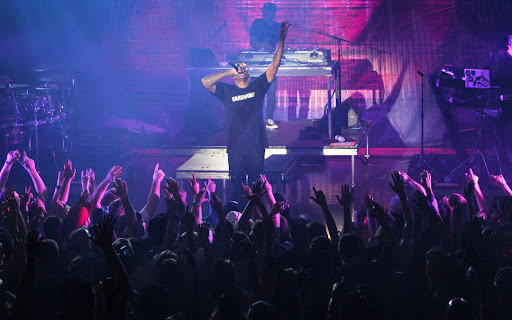 Christian rap music artist, Lecrae, performing in 2019