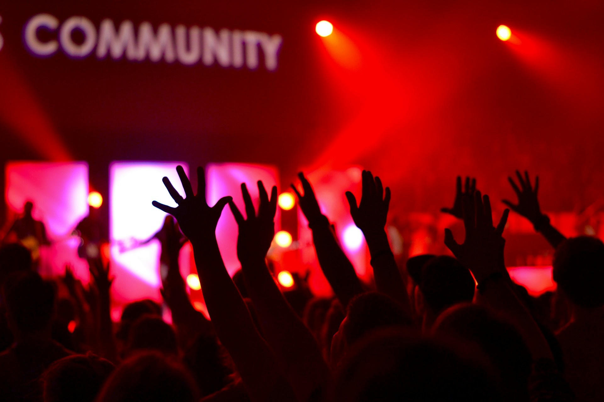 A church congregation during worship in red lights