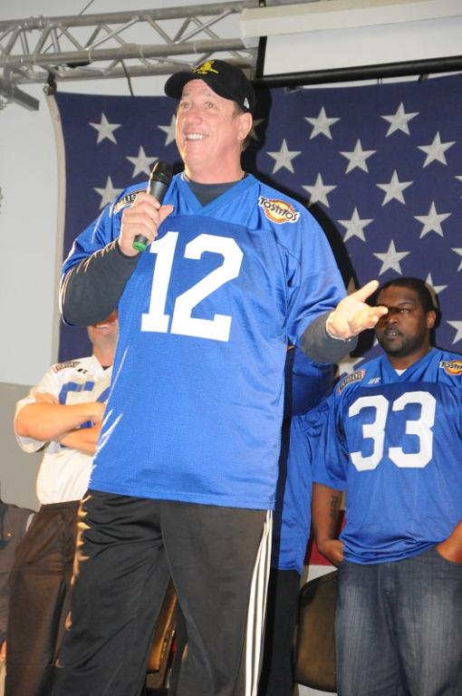 Jim Kelly, former quarterback for the Buffalo Bills, gets the troops fired up during a pep rally Dec. 20 for Tostitos “Salute the Troops” Bowl at Joint Base Balad,
